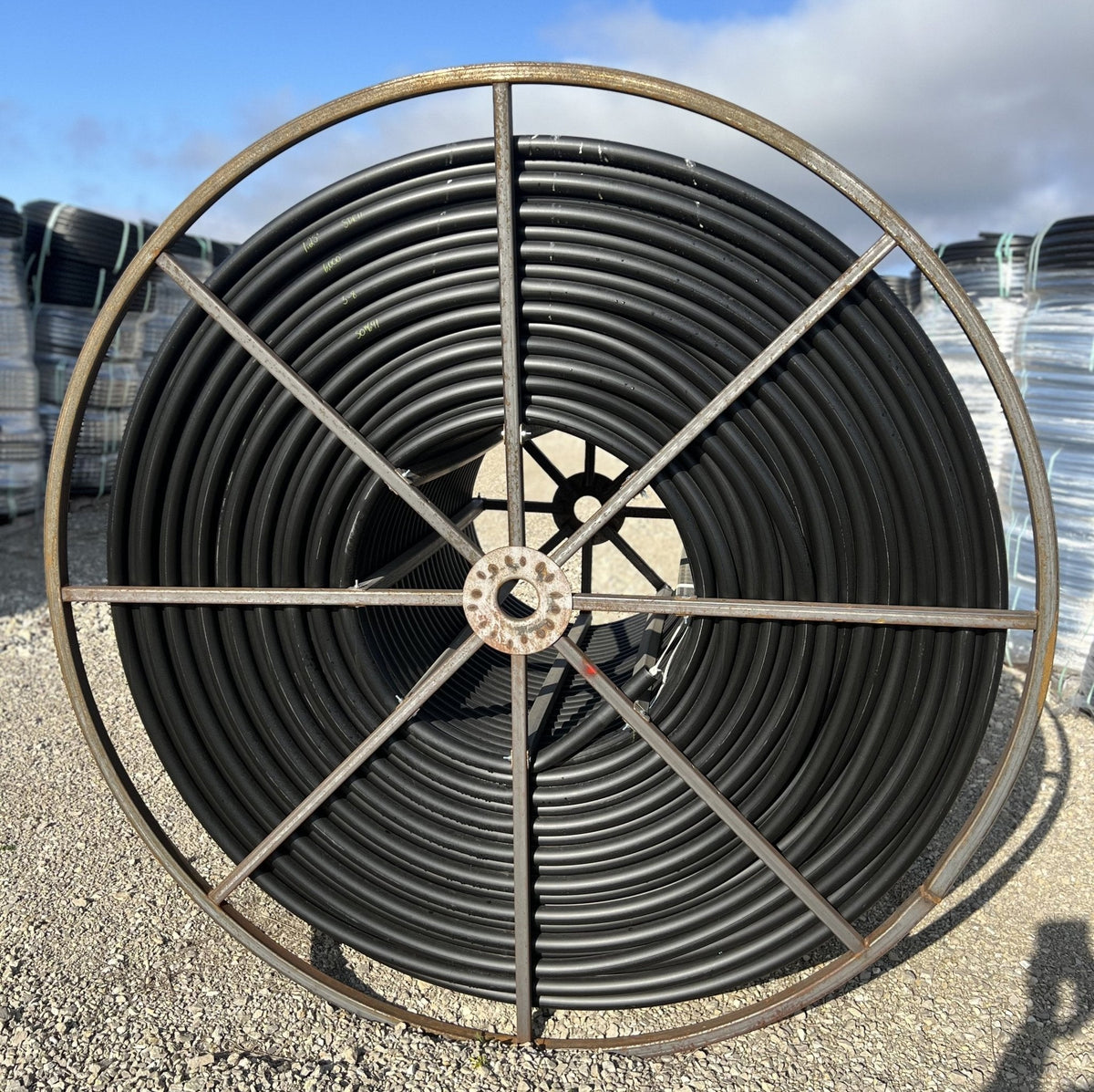 HDPE polyethylene water pipe SDR11 200 PSI on reel, white studio view